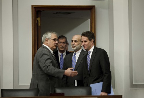 Committee Chairman Rep. Barney Frank (D-MA) speaks with Federal Reserve Chairman Ben S. Bernanke and Secretary of the Treasury Timothy F. Geithner (R) before a hearing of the House Financial Services Committee on Capitol Hill March 24, 2009.